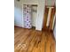 Bedroom featuring hardwood flooring and a closet with a decorative door at 2146 Lawrence Ave, Indianapolis, IN 46227