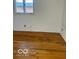 Bedroom with wood floors and a bright window at 2146 Lawrence Ave, Indianapolis, IN 46227