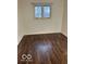 Bedroom featuring wood look floors and a bright window at 2146 Lawrence Ave, Indianapolis, IN 46227