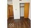 This is a bedroom with hardwood floors and a closet with sliding doors at 2146 Lawrence Ave, Indianapolis, IN 46227