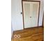 A closet with bifold doors and hardwood flooring at 2146 Lawrence Ave, Indianapolis, IN 46227
