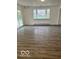 Large living room with sliding glass doors and light gray wood look floors at 2146 Lawrence Ave, Indianapolis, IN 46227