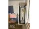 Enclosed water heater in utility area needing renovation at 2146 Lawrence Ave, Indianapolis, IN 46227