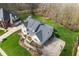 Stunning aerial view of the property showcasing the spacious home, lush lawn, and well-manicured landscaping at 2170 Running Brook Ln, Greenwood, IN 46143