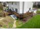 Expansive tiered deck overlooking landscaped grounds, offering multiple seating areas and outdoor living spaces at 2170 Running Brook Ln, Greenwood, IN 46143