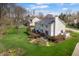 Spacious backyard featuring a lush lawn, mature trees, and a large deck perfect for entertaining at 2170 Running Brook Ln, Greenwood, IN 46143