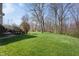 Expansive backyard with a well-manicured lawn and mature trees creating a serene outdoor space at 2170 Running Brook Ln, Greenwood, IN 46143
