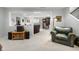 Finished basement featuring cozy seating area, record player, and stairs to the main floor at 2170 Running Brook Ln, Greenwood, IN 46143
