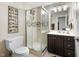 Well-lit bathroom featuring a glass-enclosed shower, modern vanity, and stylish decorative accents at 2170 Running Brook Ln, Greenwood, IN 46143