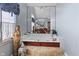 Bathroom featuring jacuzzi tub, and large window with black valance at 2170 Running Brook Ln, Greenwood, IN 46143
