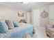 Bright bedroom with neutral walls, a comfortable chair, and an accent clock at 2170 Running Brook Ln, Greenwood, IN 46143
