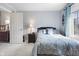 Comfortable bedroom with neutral tones, a bedside table, and natural light at 2170 Running Brook Ln, Greenwood, IN 46143