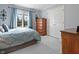 Cozy bedroom with a large window, soft blue accents, and ample closet space at 2170 Running Brook Ln, Greenwood, IN 46143