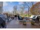 Spacious wooden deck featuring outdoor seating and views of the landscaped backyard at 2170 Running Brook Ln, Greenwood, IN 46143
