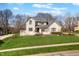 Charming two-story brick home featuring a landscaped yard and a classic architectural design at 2170 Running Brook Ln, Greenwood, IN 46143