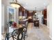 Spacious kitchen with dark wood cabinets, tile floors, and center island at 2170 Running Brook Ln, Greenwood, IN 46143