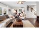 Hardwood floors, a fireplace, staircase to the 2nd floor, and open access to other areas of the home at 2170 Running Brook Ln, Greenwood, IN 46143