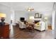 Cozy living room featuring hardwood floors, a fireplace, and comfortable seating arrangement at 2170 Running Brook Ln, Greenwood, IN 46143