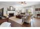 Bright living room with hardwood floors, fireplace, and ample natural light, perfect for entertaining at 2170 Running Brook Ln, Greenwood, IN 46143