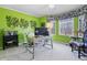 Bright office with bright green walls, a large window, and a stylish desk at 2170 Running Brook Ln, Greenwood, IN 46143