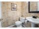 Charming powder room featuring decorative wallpaper and pedestal sink at 2170 Running Brook Ln, Greenwood, IN 46143