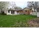 Backyard featuring a mix of brick and siding at 218 Demarest Dr, Indianapolis, IN 46214