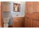 A bathroom featuring a wood vanity and mirror with medicine cabinet at 218 Demarest Dr, Indianapolis, IN 46214