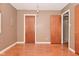 A bedroom with wood flooring, and doors to a closet and another room at 218 Demarest Dr, Indianapolis, IN 46214