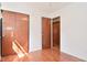 This bedroom boasts hardwood floors, a double door closet, and is connected to an adjacent room at 218 Demarest Dr, Indianapolis, IN 46214