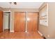 Spacious bedroom with hardwood floors, a closet, and a window that lets in natural light at 218 Demarest Dr, Indianapolis, IN 46214
