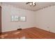 Inviting bedroom with hardwood floors, ceiling fan, natural light, and classic charm, creating a serene retreat at 218 Demarest Dr, Indianapolis, IN 46214
