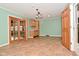 Bright dining room has tiled flooring and access to additional spaces in the home at 218 Demarest Dr, Indianapolis, IN 46214