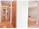 Well-lit hallway featuring hardwood floors and closet providing practical storage and seamless transition between rooms at 218 Demarest Dr, Indianapolis, IN 46214