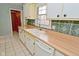 The kitchen has a dishwasher, sink, and bright, clean surfaces at 218 Demarest Dr, Indianapolis, IN 46214