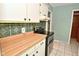 The kitchen features modern appliances and updated cabinetry, ready for your touch at 218 Demarest Dr, Indianapolis, IN 46214