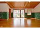 Large living room with wood floors, wood ceiling, and a sliding glass doors at 218 Demarest Dr, Indianapolis, IN 46214