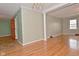 Spacious living room with hardwood floors and neutral walls is ready for your updates at 218 Demarest Dr, Indianapolis, IN 46214