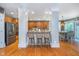 Open kitchen and dining area with breakfast bar, perfect for entertaining or casual meals at 2353 Woodcreek Crossing Blvd, Avon, IN 46123