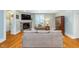 Comfortable living room featuring a stone fireplace, hardwood floors, and stylish furnishings at 2353 Woodcreek Crossing Blvd, Avon, IN 46123