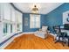 Comfortable office featuring hardwood floors, a bay window, and a relaxing chaise lounge at 2353 Woodcreek Crossing Blvd, Avon, IN 46123