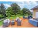 Outdoor patio featuring comfortable seating around a fire pit and a beautifully landscaped backyard at 2353 Woodcreek Crossing Blvd, Avon, IN 46123