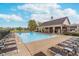 Community pool featuring lounge chairs, clear blue water, and a covered pavilion at 2353 Woodcreek Crossing Blvd, Avon, IN 46123