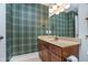 Stylish powder room featuring unique wallpaper, a framed mirror, and a vanity with a sink at 2353 Woodcreek Crossing Blvd, Avon, IN 46123