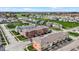 Community aerial showcasing diverse homes, manicured lawns, and a serene pond backdrop at 2627 Congress St, Carmel, IN 46032
