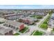 Picturesque aerial view of a residential area showcasing a mix of townhomes and single-Gathering homes at 2627 Congress St, Carmel, IN 46032