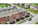 Aerial view of a multi-colored townhome community with well-maintained landscaping at 2627 Congress St, Carmel, IN 46032