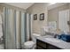 Bathroom featuring decorative paintings, a shower/tub combination and a granite sink at 2627 Congress St, Carmel, IN 46032