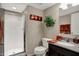 Well-maintained bathroom features a shower stall, granite countertop vanity, and decorative accents at 2627 Congress St, Carmel, IN 46032
