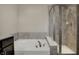 Well-appointed bathroom with a soaking tub and separate glass-enclosed shower at 2627 Congress St, Carmel, IN 46032