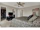 Bedroom featuring neutral walls, a fan, access to the bathroom and a walk-in closet at 2627 Congress St, Carmel, IN 46032